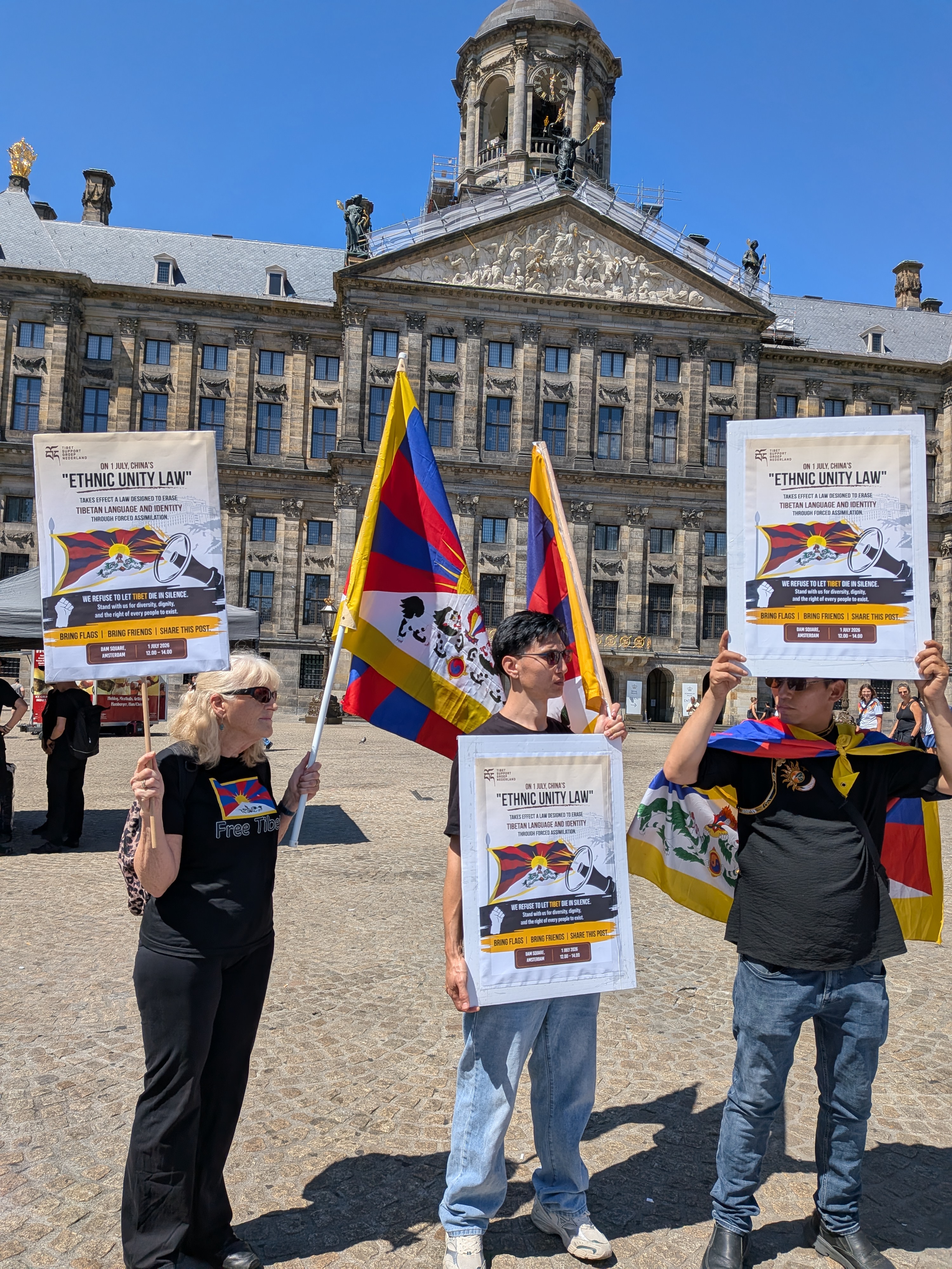 Participants with flags and banners during the protest against China's Ethnic Unity Law on Dam Square in Amsterdam, 1 July 2026